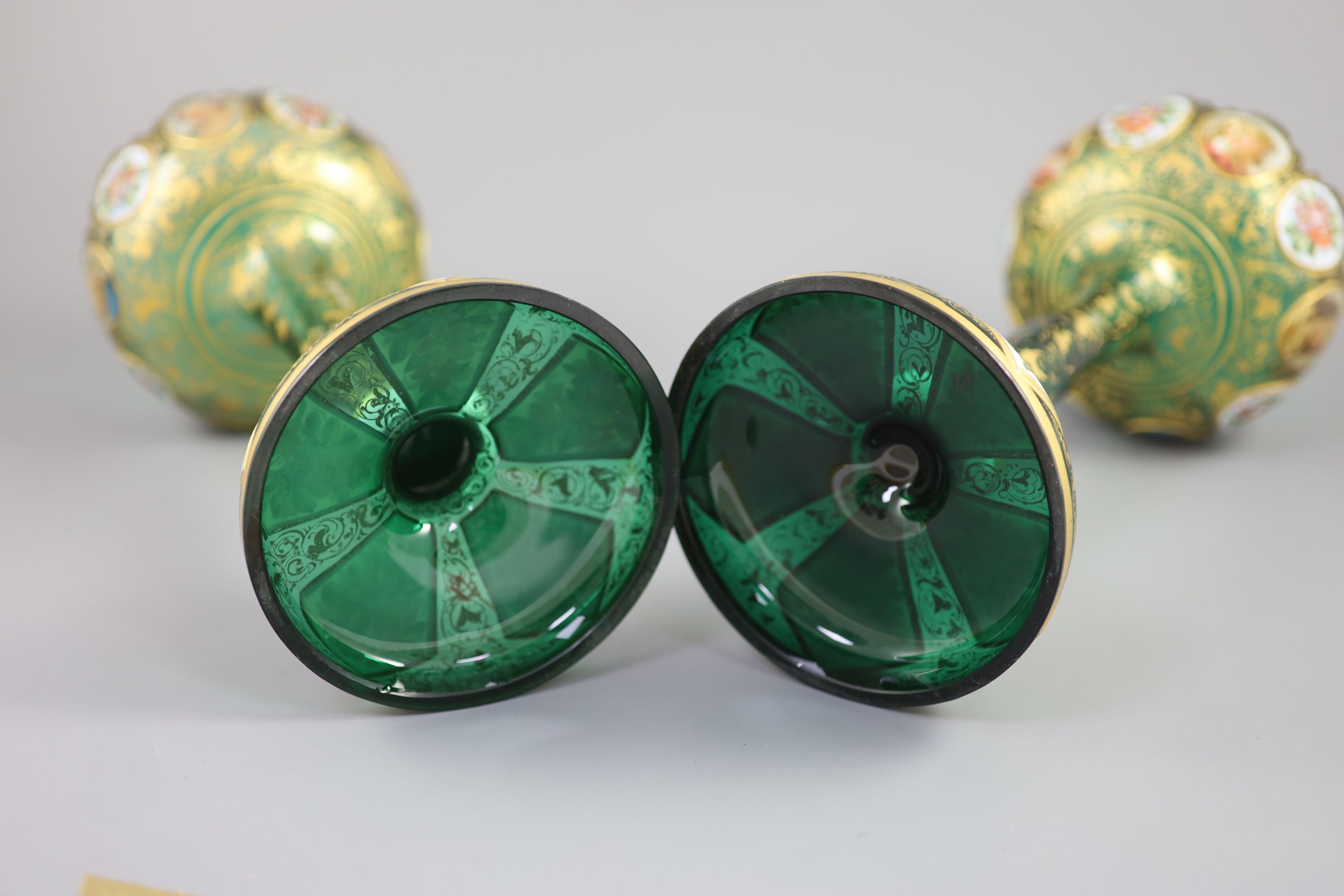 A pair of Bohemian enamelled white overlaid green glass vases, late 19th century, 31cm high